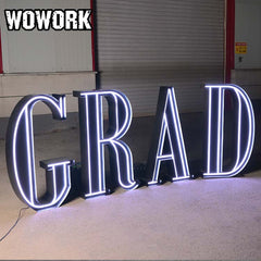 black marquee letters "grad"