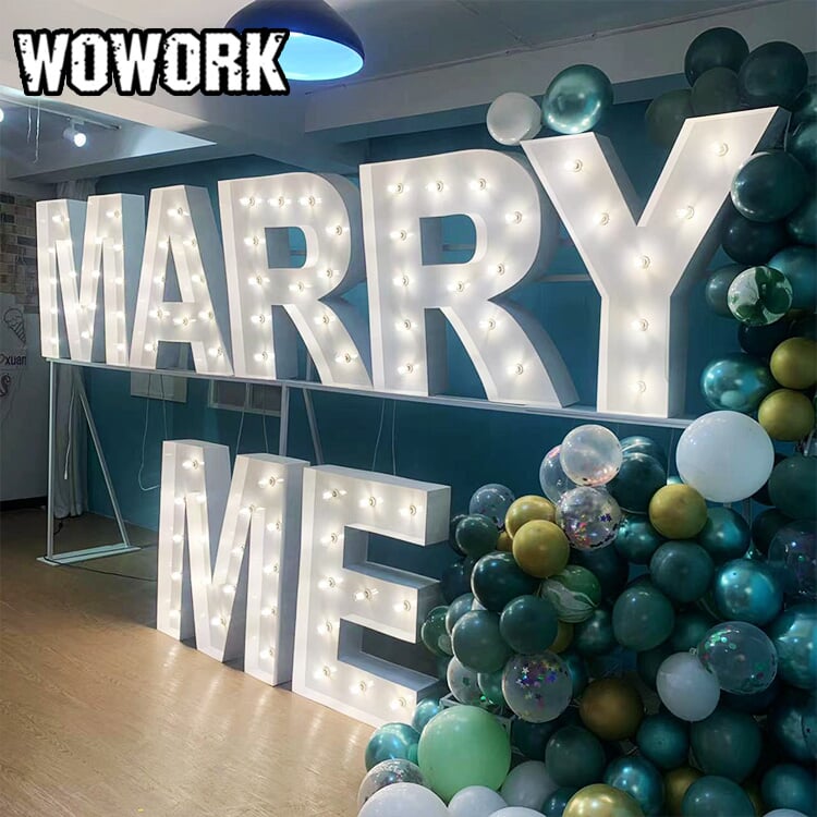 Custom 4ft marquee letters glowing at a wedding party