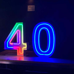 Custom 4 foot marquee letters glowing at an outdoor wedding