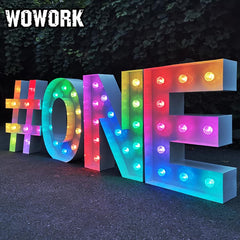 Bright large marquee letters creating a party backdrop