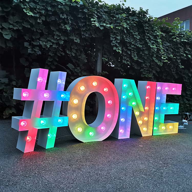 Light up marquee letters "ONE" with lights for birthday event decoration