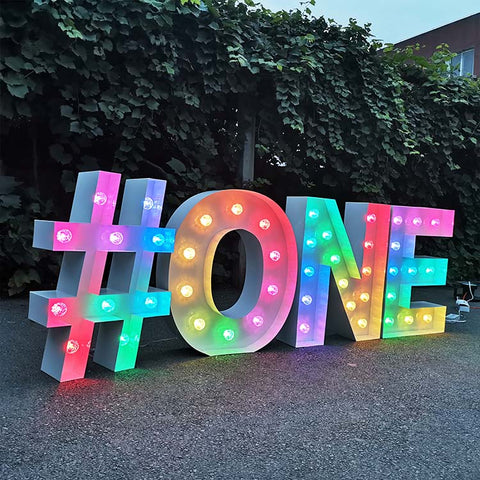 Light up marquee letters "ONE" with lights for birthday event decoration